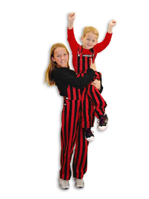 Two kids wearing striped red & black youth game bib overalls