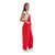 Side profile view of a woman wearing solid red Game Bibs overalls, highlighting the clean fit and the secure two buttons on the side opening.