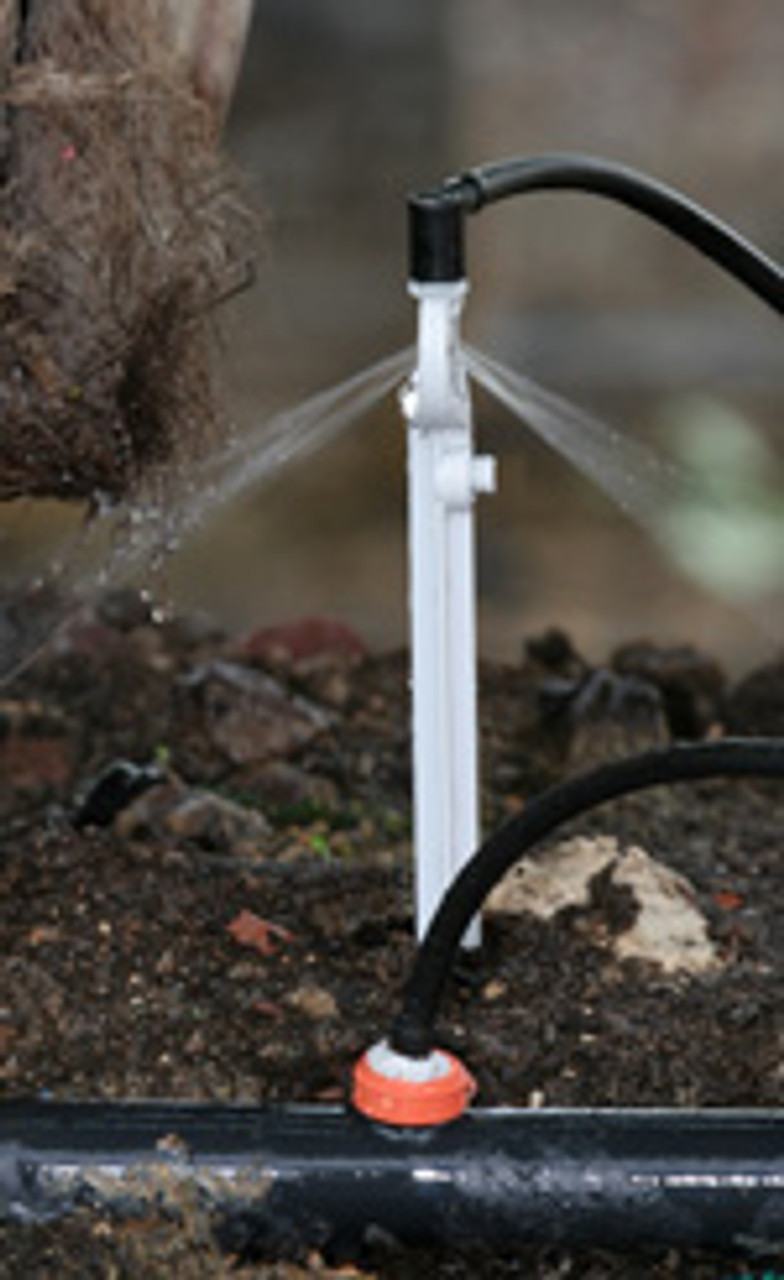 PCJ 20 L/Hour CNL Dripper on a Grey Two-Sided Spray Stake with tube and elbow.