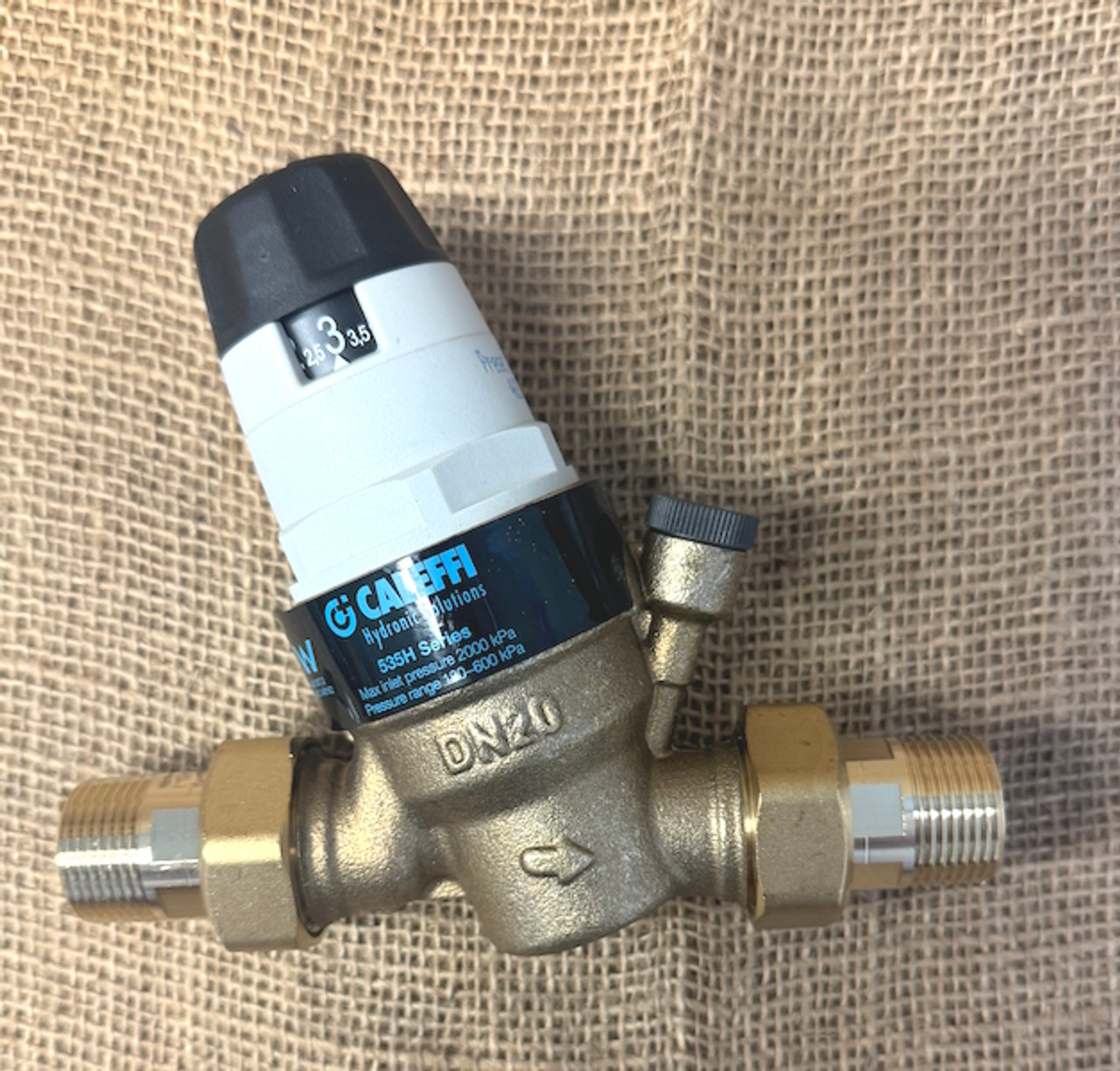 Caleffi 535 series pressure reducing valve with pressure gauge port and included brass unions.