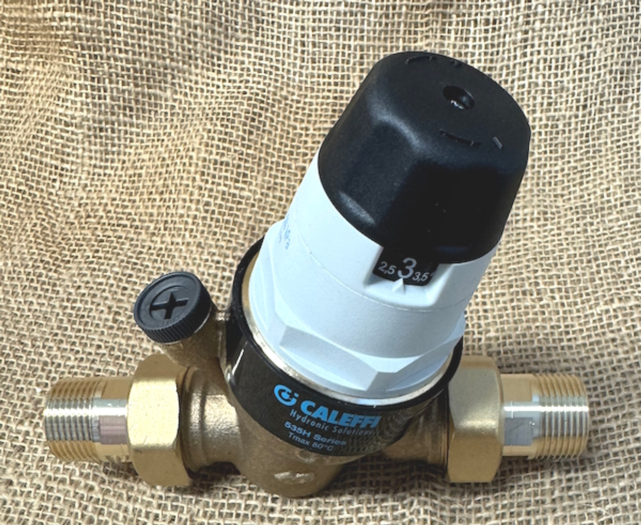 Caleffi 535 series pressure reducing valve with pressure gauge port and included brass unions.