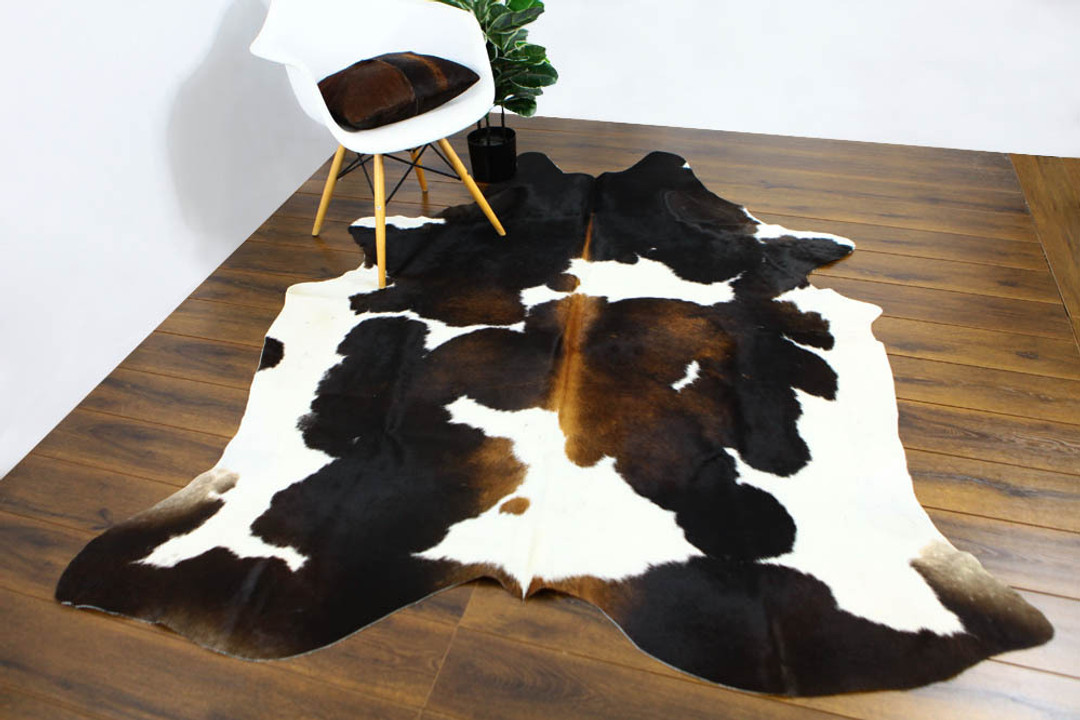 REMOVING LIQUID STAINS FROM A COWHIDES RUGS