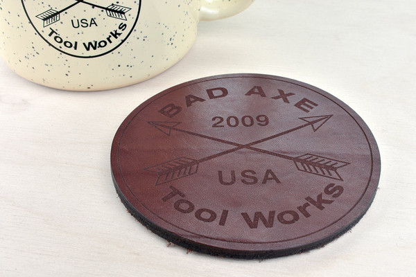 Bad Axe Logo Leather Coaster with mug in background
