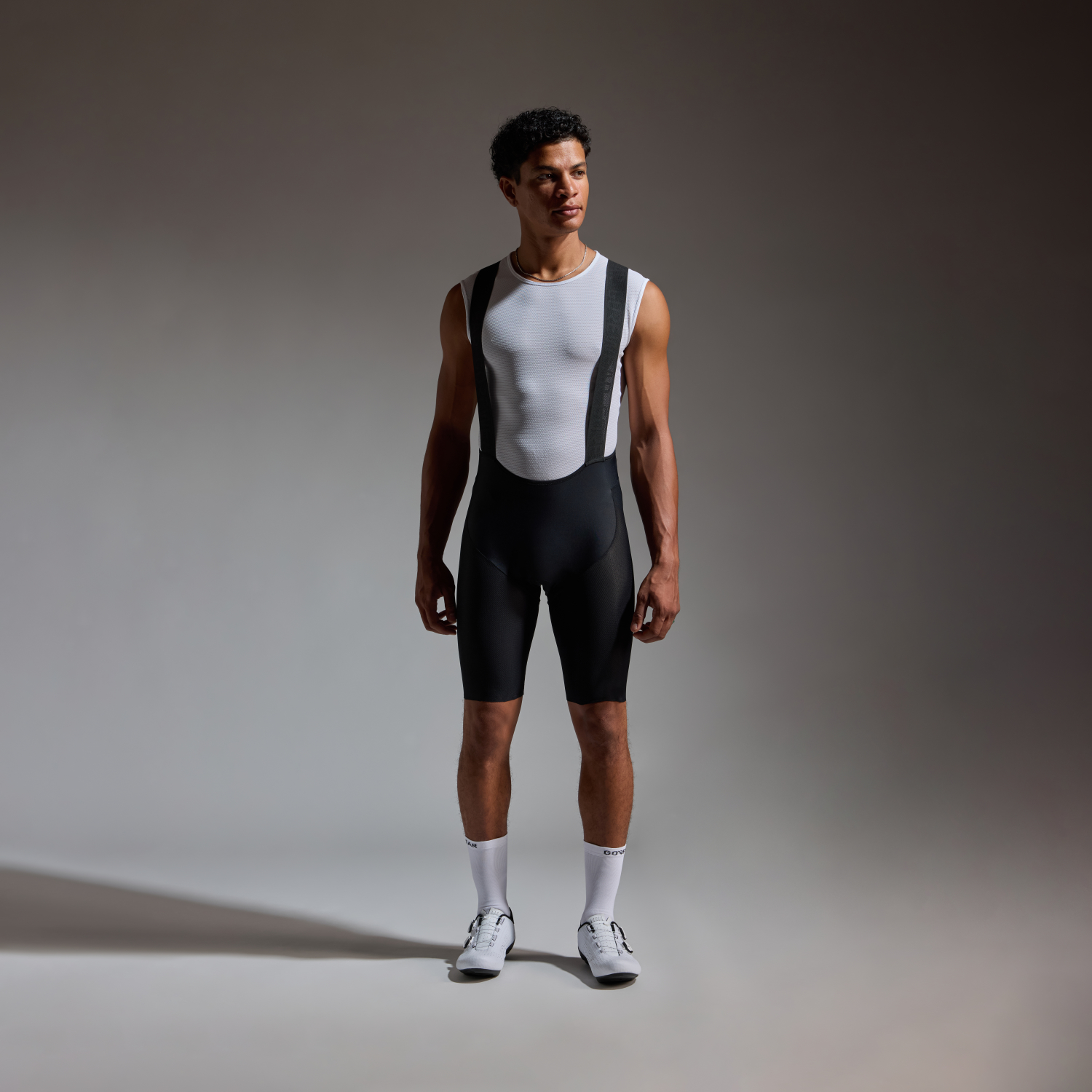 A product model is wearing the FERNFLOW Liner Bib Shorts Mens in size EU Large / US Medium and is 185 cm / 6'1'' and weighs 85 kg / 187 lbs.