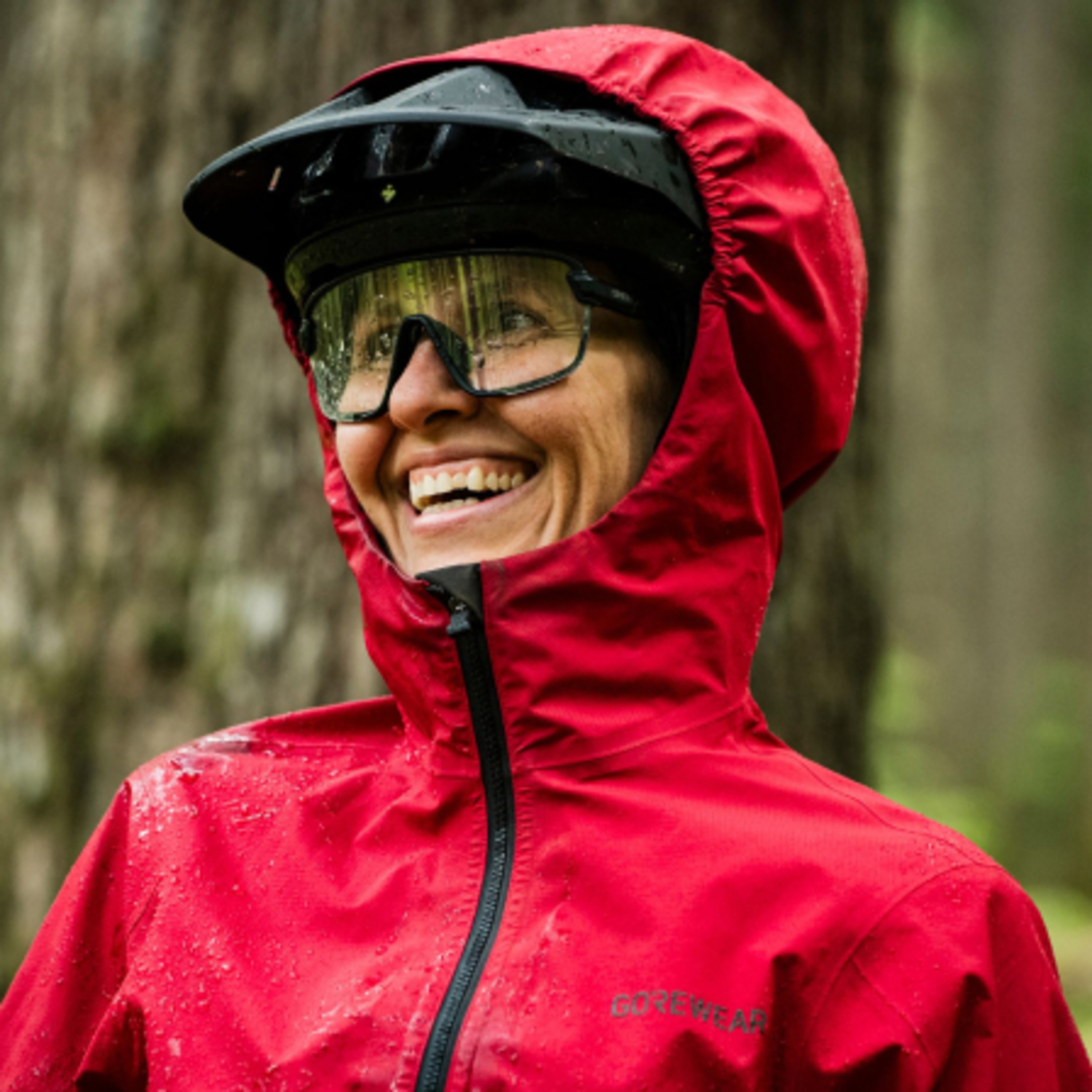 A lifestyle image of the LUPRA 2.0 GORE-TEX Hooded Jacket Womens being used.