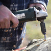 Side angle view of the  Express Drill Tool, a converted angle grinder for high-speed drilling.