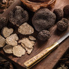 A fresh harvest of truffles on the cutting board and ready for a culinary adventure.