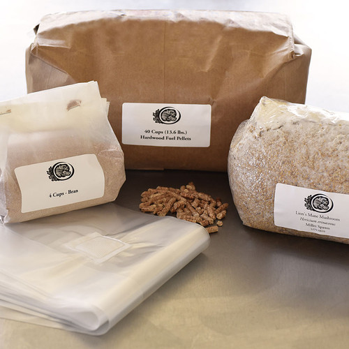 The components of a DIY block kit - bran, fuel pellets, bags, and lion's mane grain spawn