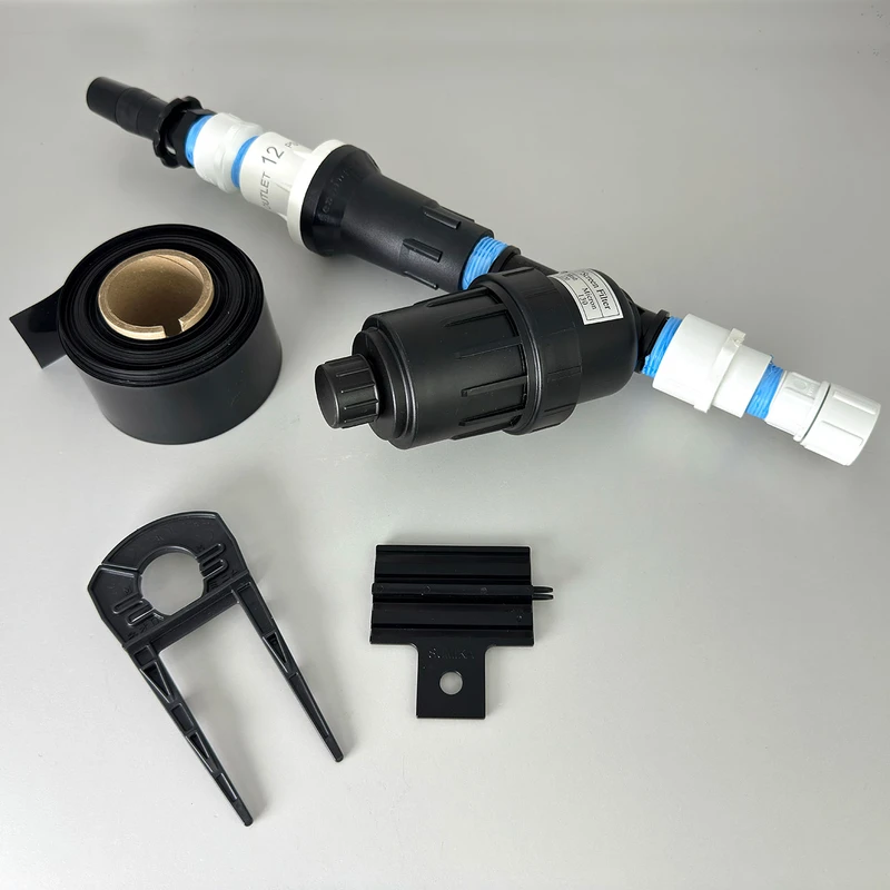 Irrigation system bundle components including tubing, premium garden hose connector, field holder and stopper.