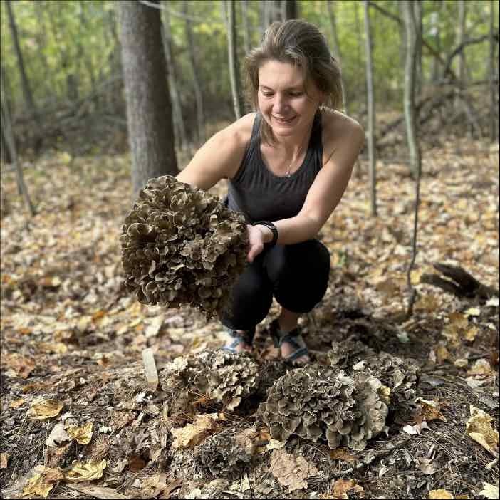 girl holding maitake mushroom