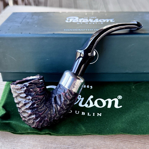 Peterson System Standard Rusticated (313) P-Lip Tobacco Pipe NewFeaturing Peterson's proprietary System drilling construction, the System Standard line offers a bright metal mount fitted to a craggy rustication, as seen here on this cylindrical "313" bent Billiard rendition. Pipe tobacco, burley, latakia, dark fired, Virginia, natural. Pipe smoking, tobacco pipe,pipesmoking, pipe smoker, pipe smokers, smoking pipe, smoking pipes, smoking pipe, savinelli, dunhill, Peterson,english pipe tobacco, burley pipe tobacco blend, comoys, meerschaum, tobacco pipe store, aromatic pipe tobacco, Cornell&deihl, pipe smoking community,Nording, estate pipe, Estate pipes, billiard, room Paul, bulldog, bent billiard, Rusticated, Sandblasted, Tomato, Blowfish, prince, Stokkebye,Rattrays,