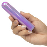 Hand holding CalExotics AURA Rounded purple vibrator to show compact size and rounded shape