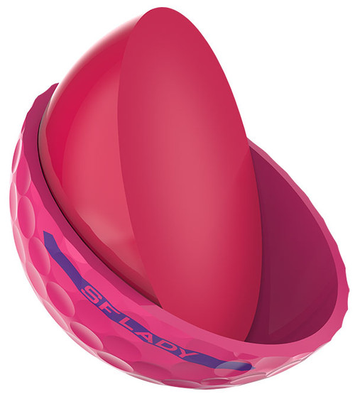 A single pink Soft Feel Lady Passion Pink golf ball cut in half to show the inner core