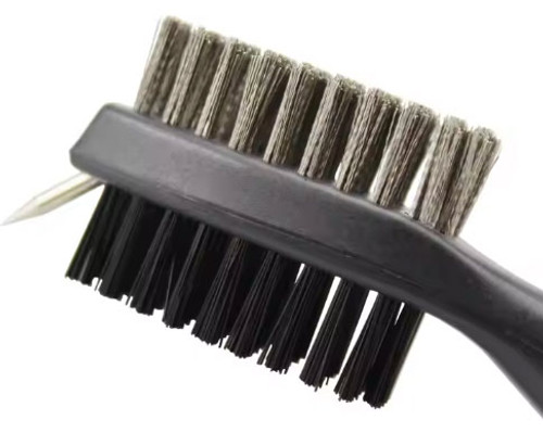 A close up of the double ended golf club cleaner brush