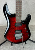 Sterling by Music Man JP100D John Petrucci guitar in ruby red burst