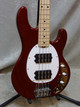 Sterling StingRay RAY4HH-CAR-M1 bass guitar in candy apple red finish