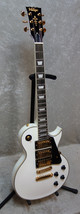Vintage Brand  V1003AW  electric Les Paul 3 pickup guitar - Arctic white / gold 