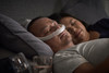 Man sleeping and wearing a ResMed AirFit P30i Nasal Pillow CPAP Mask