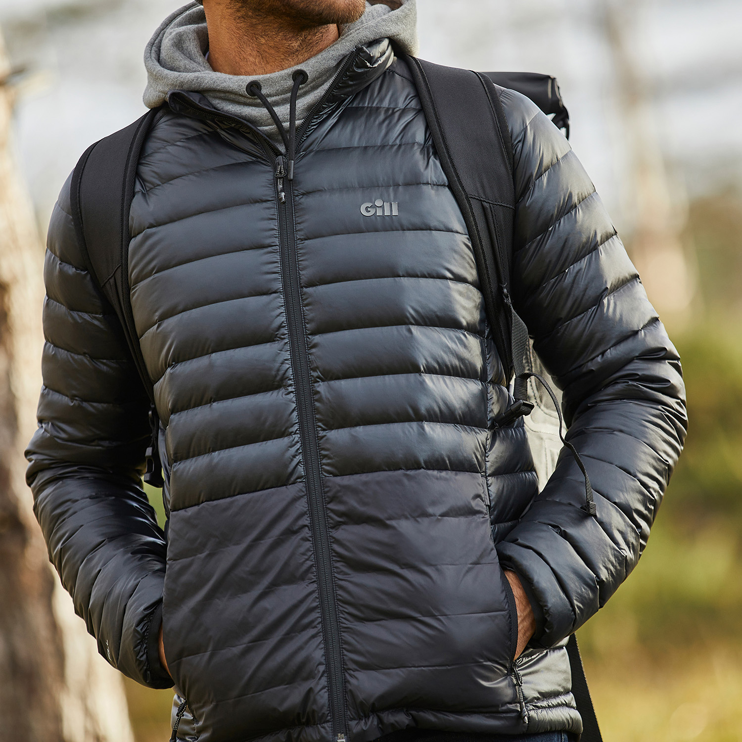 Man wearing a Gill Portland Jacket in the woods