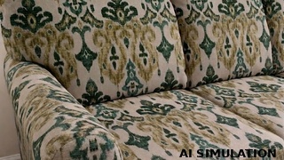 AI simulation of fabric SKU 2018611 showing a beige and teal ikat upholstery fabric on a traditional upholstered chair to illustrate pattern scale, color, and upholstery use.