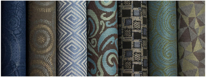 Assorted commercial contract grade upholstery fabrics in textured patterns and colors for hospitality, healthcare, office, restaurant, and high-traffic furniture applications.