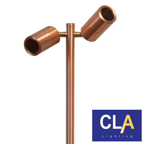 Polished copper outdoor garden double spiked pole light with two adjustable heads for landscape lighting in Australia.