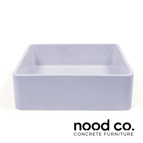 Modern lilac square concrete vessel sink handcrafted by Nood Co, surface mounted for a minimalist bathroom design in Australia.