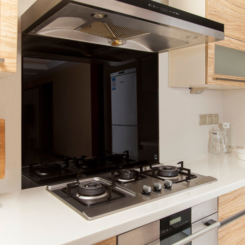 Toughened black glass kitchen splashback for modern Australian homes.