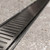 Modern Midnight Black Lauxes NXT14 Aluminium Linear Shower Grate Installed in a Contemporary Australian Bathroom