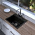 Modern square matte black granite kitchen sink, ideal for contemporary Australian homes.
