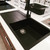 Carysil Enigma 100L Single Bowl Granite Kitchen Sink in Matte Black finish installed in a modern Australian kitchen laundry setting.