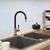 Swedia Klaas black kitchen mixer tap with brushed finish installed in a modern Australian kitchen setting.