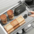 Elite Slate Magic Corner II Pull-Out Kitchen Storage for 900mm blind corner cabinets featuring four dark grey anti-slip baskets and soft-close technology for modern Australian kitchens.