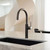 Modern gunmetal boiling water dispenser tap installed in a stylish Australian kitchen setting.