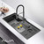 Multifunction smart kitchen workstation sink in gunmetal grey stainless steel with integrated waterfall faucet and digital temperature display for modern Australian homes.