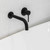 Modern matte black bathroom mixer tap with a minimalist curved spout and slim handle, ideal for contemporary Australian homes.