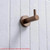 Luxury Meir Round Robe Hook in Electroplated Champagne finish for elegant bathroom organization and towel storage in Melbourne, Australia.