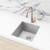 Meir Round Champagne Gooseneck Kitchen Mixer Tap installed on an undermount sink in a modern Australian home.