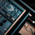 Pull-out wardrobe jewelry and watch drawer with soft teal leather lining and velvet watch pillows for luxury closet storage in Australia.
