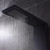 Contemporary matte black shower tapware featuring a wall-mounted round mixer and sleek minimalist handle for modern Australian bathrooms.