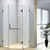 Modern frameless diamond shape glass shower screen with chrome hinges installed in a contemporary Australian bathroom.