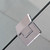 Durable stainless steel hinges on a frameless safety glass shower screen for a modern Australian bathroom renovation.