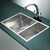 Deep double bowl top mount stainless steel kitchen sink in a modern Australian home.