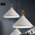 Modern white Anitra pendant light with a sleek cone-shaped metal shade, ideal for kitchen island and dining room lighting in Australian homes.