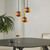 Modern matte black interior dome pendant light hanging from a white ceiling for kitchen or dining room styling.