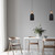 Modern Scandinavian Horten oblong pendant lights in matte white and black finishes with wood-style accents installed over a dining table in an Australian home interior.