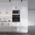 Modern Glossy White Flat Pack Kitchen Cabinetry - Sleek Handleless Modular Design for Contemporary Australian Home Renovations.