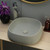 Modern matte white solid limestone square above counter bathroom basin by Moku, luxury natural stone vessel sink for contemporary Australian homes.