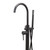Modern matte black floor-mounted bath spout with mixer, diverter, and handheld shower head for contemporary Australian bathroom renovations.