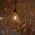 Vintage A80 LED filament light bulb with a silver mirror cap installed in a modern pendant light fixture, providing warm ambient lighting for Australian homes.